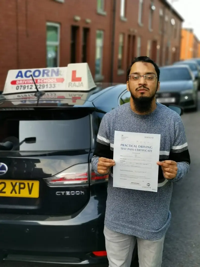 Student celebrating after passing automatic driving lessons in Blackburn