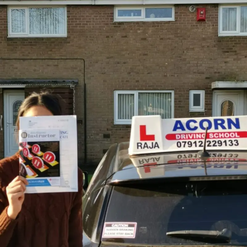 New driver celebrating a successful driving test pass in Blackburn